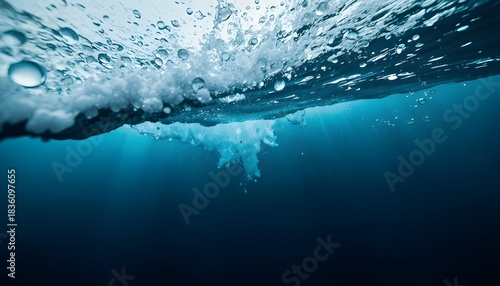 Deep blue stormy sea viewed underwater with abstract blurred waves, creating dramatic and immersive aquatic scene