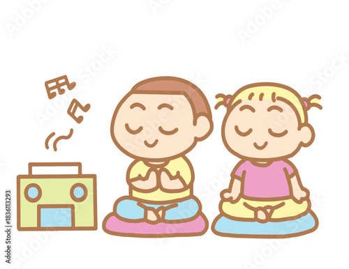 Two children sit and meditate on their breath.