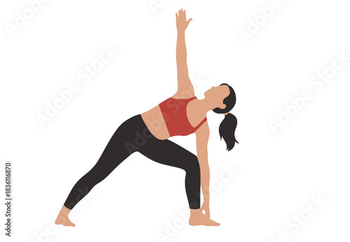 Woman achieves peaceful extended side angle yoga pose in fitness attire