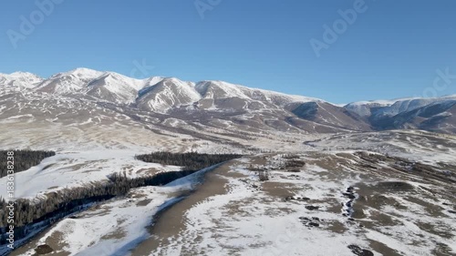 Winter snow highland mountain mist valley under foggy sky Altai Mountains Siberia. top view, aerial view