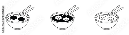 Warm miso soup with tofu and chopsticks in bowls graphic.