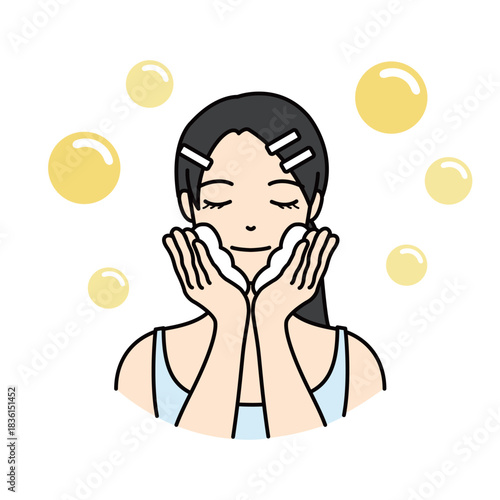 Woman washing her face with rich foam and yellow bubbles