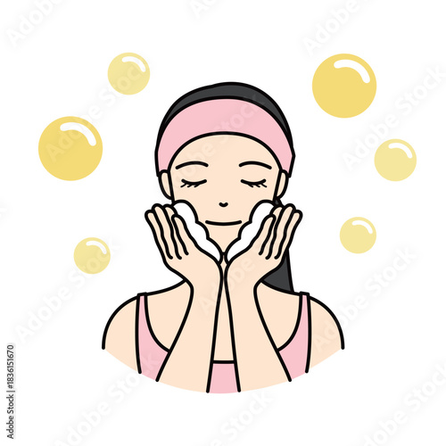 Woman washing her face with foam for daily beauty routine