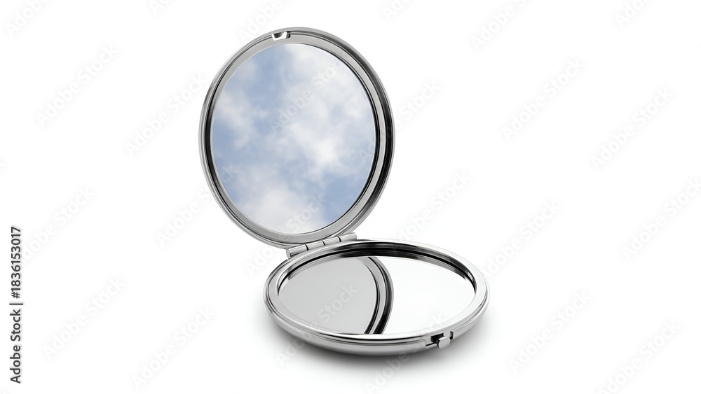 Fototapeta premium Open silver compact mirror reflecting a cloudy blue sky against a white background