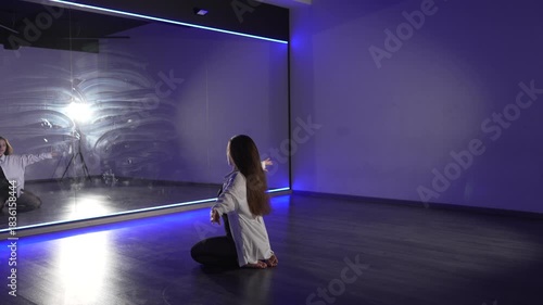 Wallpaper Mural Dancer contemporary expression, sensual movements in modern studio with dramatic blue lighting. Torontodigital.ca