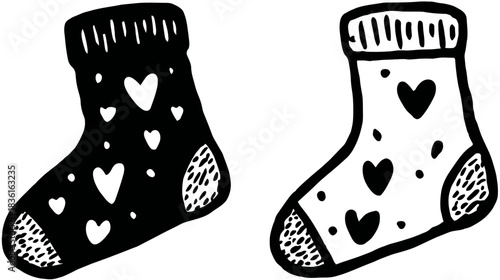 Hand drawn black and white socks with heart patterns. Doodle illustration of cozy winter foot accessories, perfect for love and warmth.