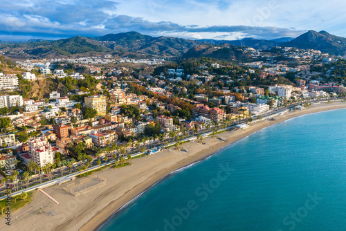 Vibrant Coastal Metropolis: Sweeping Aerial View of Málaga, Spain, Featuring Palm Tree-Lined Beaches, the Bustling Port, and the Expanding Cityscape