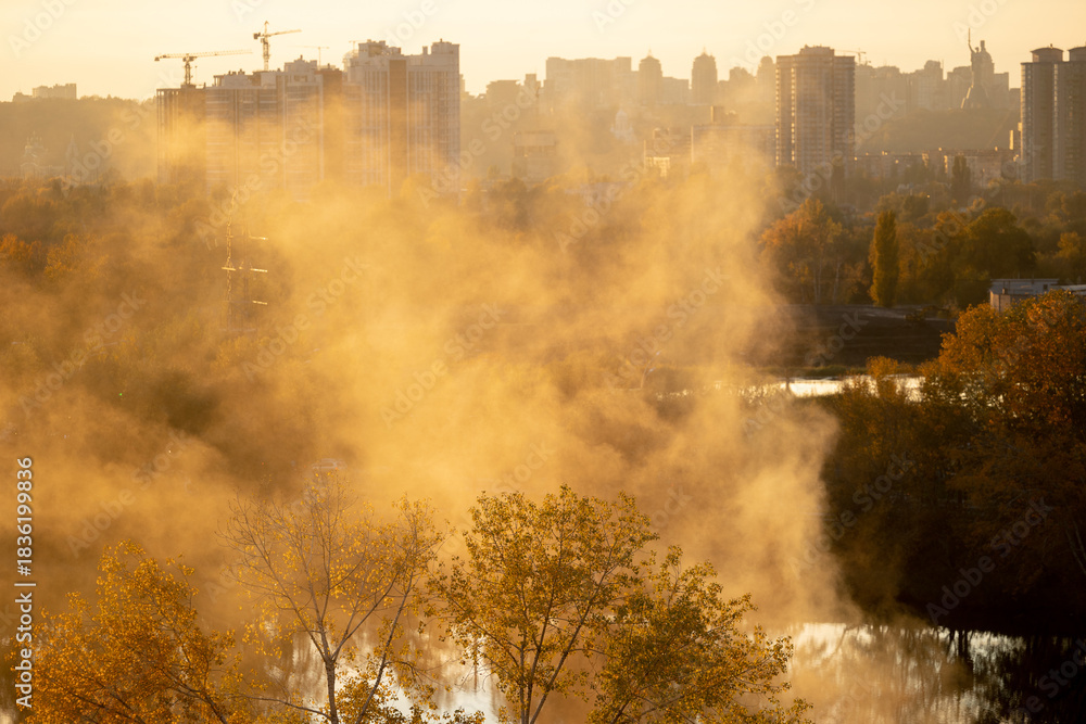 Obraz premium Scenic urban landscape view of foggy lake in Kyiv at sunset