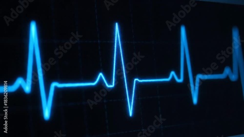 A Glowing Blue EKG Heartbeat Rhythm Displayed on a Dark Digital Monitor Screen With a Grid Background and Soft Focus for Medical Science and Technology Concepts