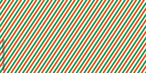 Christmas seamless pattern. Red and green diagonal stripes background. Candy cane repeating decoration wallpaper. Winter holiday lines backdrop. vector