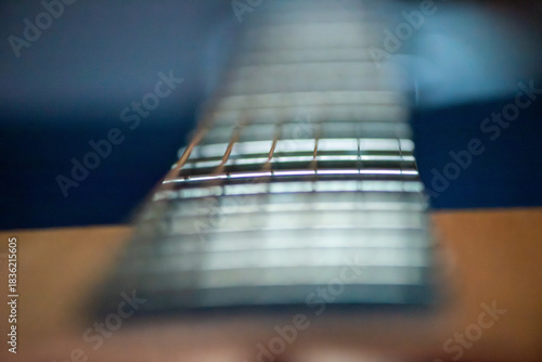 A sharp close-up photograph of an acoustic guitar highlighting its strings, wood texture, and craftsmanship. Ideal for music, instruments, creativity, and artistic product themes.