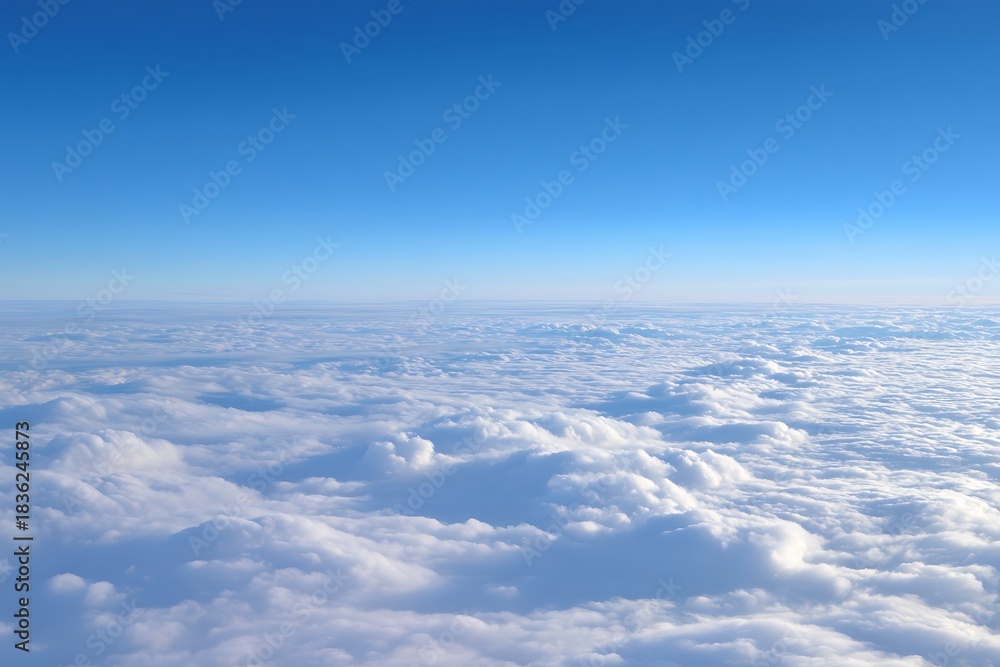 Naklejka premium Blue sky viewing vast cloud blanket from above