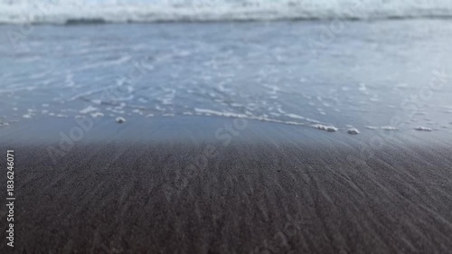 Gentle Waves on Black Sand Beach