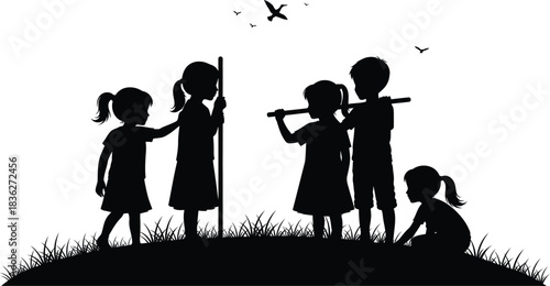 Silhouette of children playing outdoors in a field with birds flying above