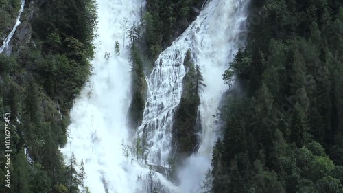 Waterfall Surrounded by Spruce Forest in Summer – Branzi, Italian Alps