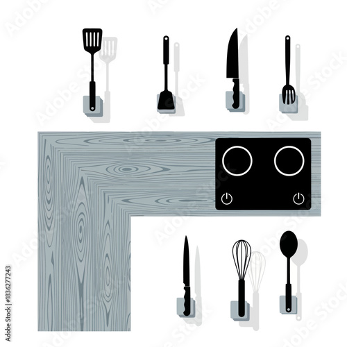 Top view of a modern kitchen countertop with electric stove and utensils.