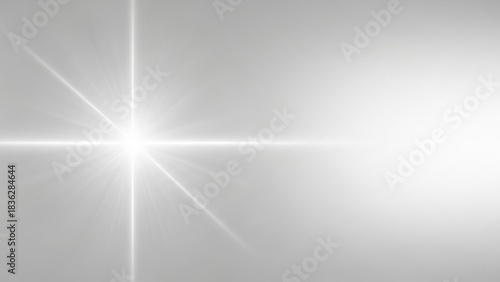 Bright white light flare on a grey background