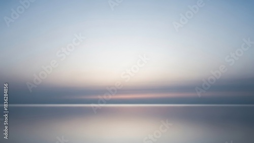 Calm water and sky with a serene glowing horizon