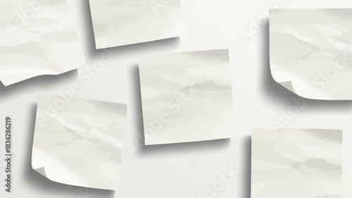 Minimalist background with crumpled paper notes scattered on a clean white surface
