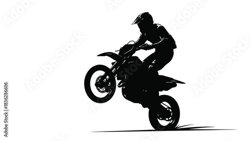 Motorcycle rider performing stunt jump