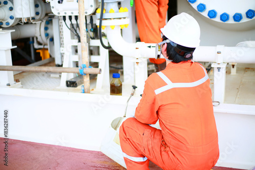 Technician monitor and command by radio to operator on job site in oil and gas industry, Worker in oil and gas industry contact to operation team to check condition of the machine, Maintenance work.