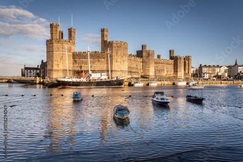 Caernarfon castle at high tide in the winter morning