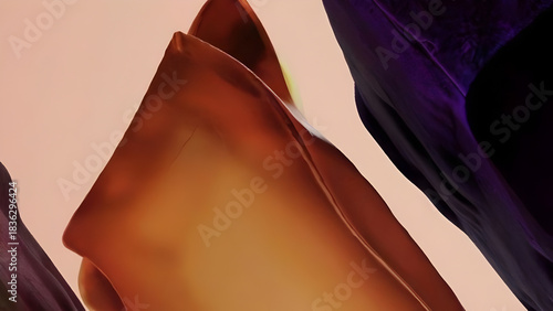 Abstract close up of folded fabric with rich earthy tones and dramatic dark purple shadows creating a sense of depth and texture