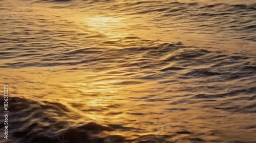 Iridescent Ocean Surface at Golden Hour — Thin-Film Abstract Aerial 4K Stock Footage