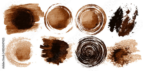 Collection of abstract brown watercolor paint splatters and brush strokes on white background