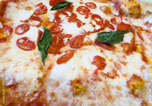 Delicious Italian pizza margherita with cherry tomatoes, cooked in the wood oven