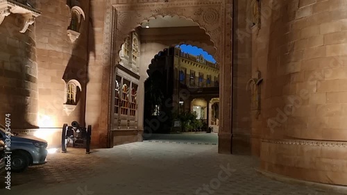 Waling in through the arched gateway of a fort in Jodhpur Rajasthan with cannons on the sides and huge windows looking out of the massive defensive stone walls
