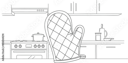 Oven mitt hanging in a kitchen with a stove and pot ready for cooking meal