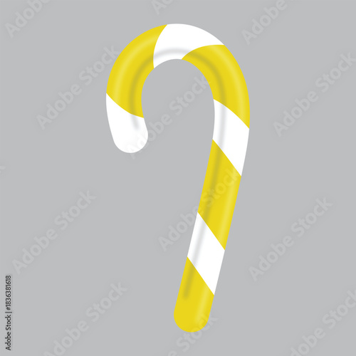 Yellow candy cane isolated on grey background sweet perfect treat for holidays