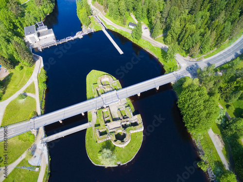 Aerial view of a ruined castle on an islet in the Kajaani River, Finland