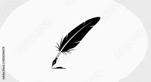 Elegant Black Feather Quill Pen with Ink Splatter on White Background.