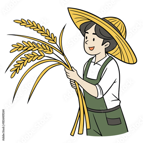 Cheerful farmer wearing a straw hat is holding golden wheat stalks while smiling