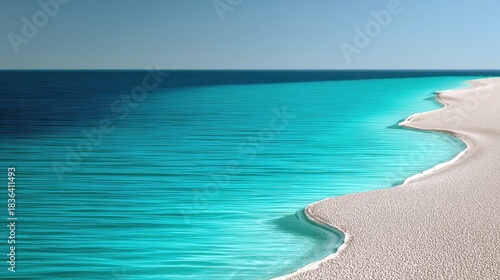 Turquoise Ocean Meets Sandy Beach Under Clear Sky