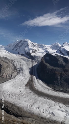 Panning shot of alpine mountains from top of Gornergrat