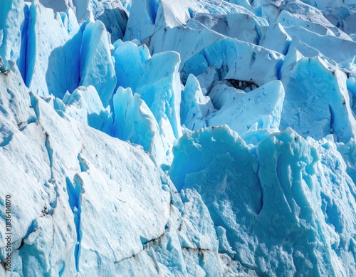 Close-up of a glacier with various shades of blue and white ice formations