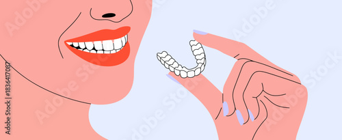 A joyful woman showcasing her bright smile while holding clear aligners, symbolizing confidence and the beauty of dental health aesthetics for a vibrant lifestyle.