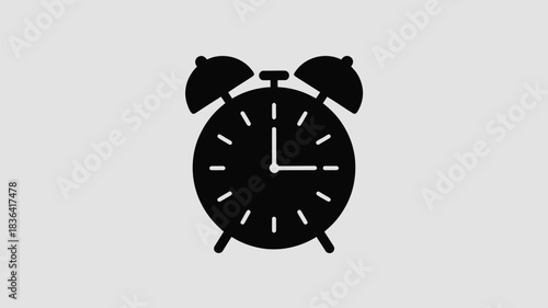 Simple black silhouette of an alarm clock on a light gray background