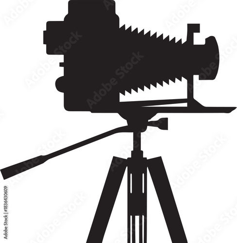 Black silhouette of a vintage bellows camera on a tripod vintage camera photography