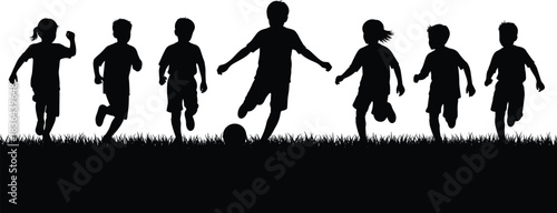 Silhouette of diverse children running and playing football (soccer) together on grass, representing teamwork, friendship, active childhood sports, and having fun outdoors on a summer day.