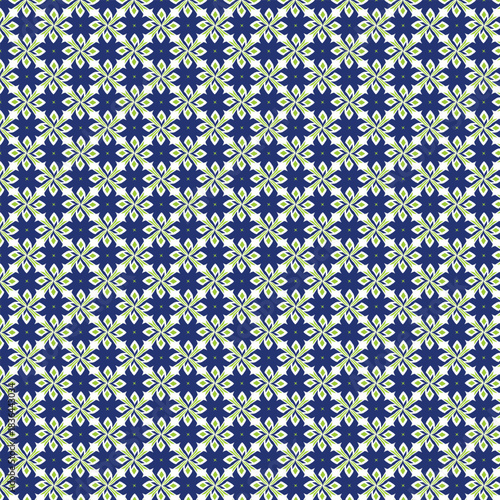 Intricate geometric mosaic pattern featuring repeating floral motifs in vibrant blue and lime green against a white background creating a visually captivating design
