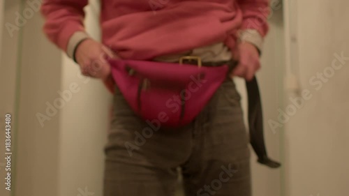 Ensuring all straps are snug and smooth, Carefully fix and fasten waistpack with gentle movements, Methodically adjusting and securing waistbag to ensure comfortable fit and stability