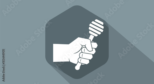 Hand holding honey dipper with gray hexagon background and long shadow
