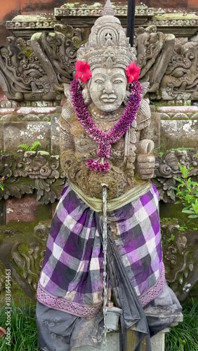 Typical statue in Pura Taman Saraswati also known as the Ubud Water Palace, is a Balinese Hindu temple in Ubud, Bali, Indonesia