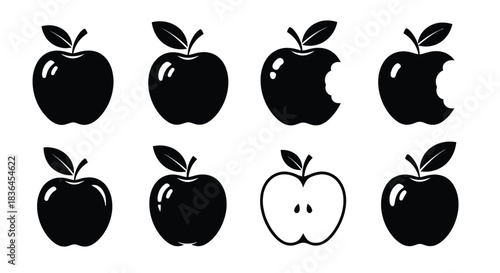 Collection of black apple icons representing whole bitten and halved fruit with leaves and stems