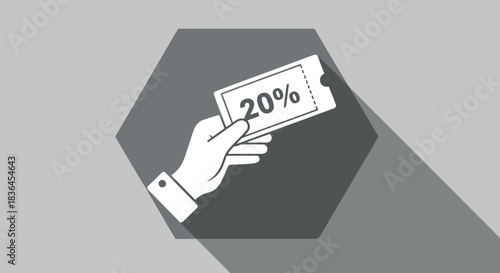 Hand holding a twenty percent discount coupon against a gray background
