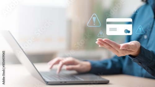 A person using a laptop with virtual warning icons and a credit card symbol, representing fraud alerts and secure transaction monitoring. Suspicious charge fraud alert secure transaction protection.